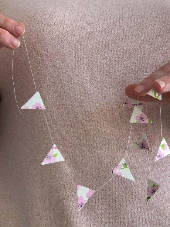 DIY Gift Tags and Mini-Garlands hands holding garland with blossoms