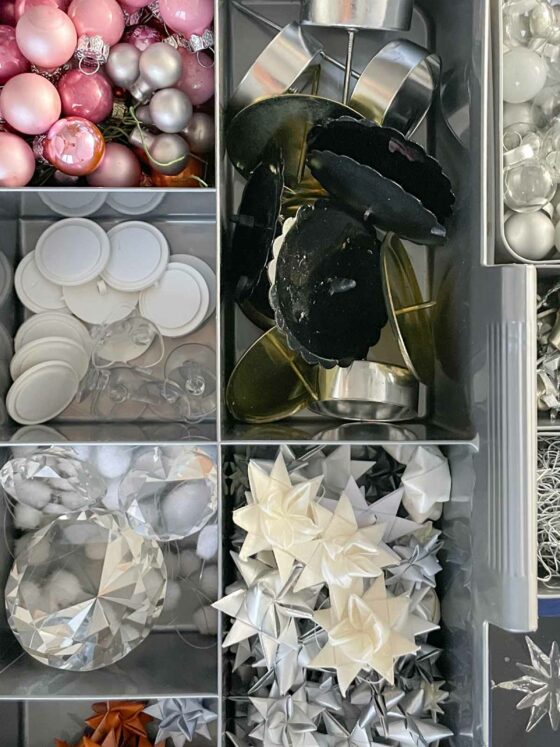 sorting christmas collection of white silver Christmas ornaments