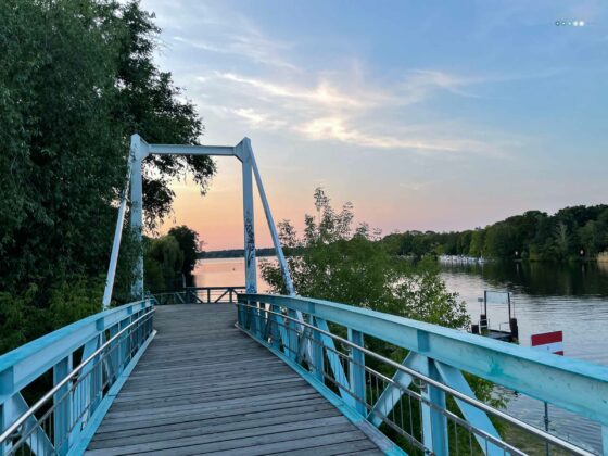 blue bridge over water ways with sunset sky – at the moment