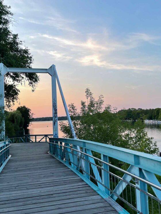 blue bridge over water ways with sunset sky – at the moment