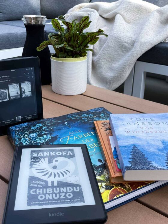 book talk march stack of books on outdoor table