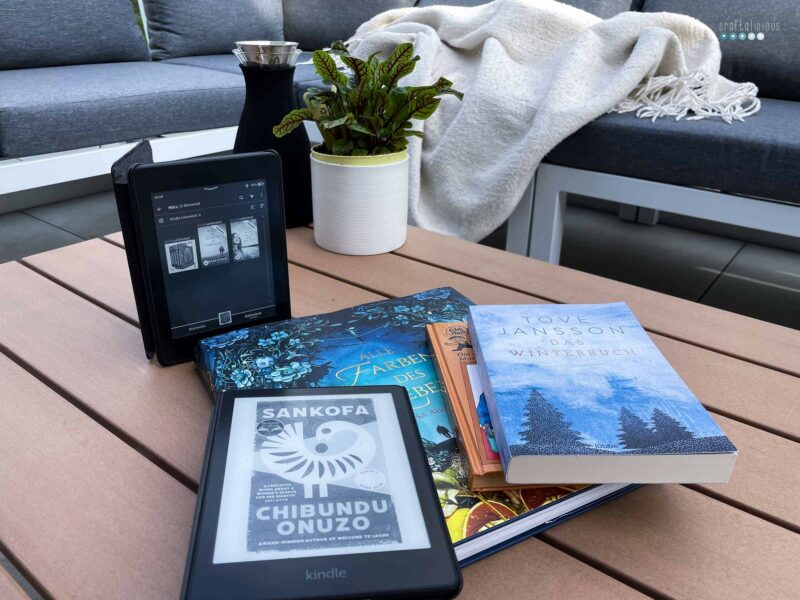 book talk march stack of books on outdoor table